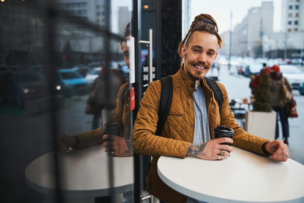 Happy person enjoying morning coffee in the city